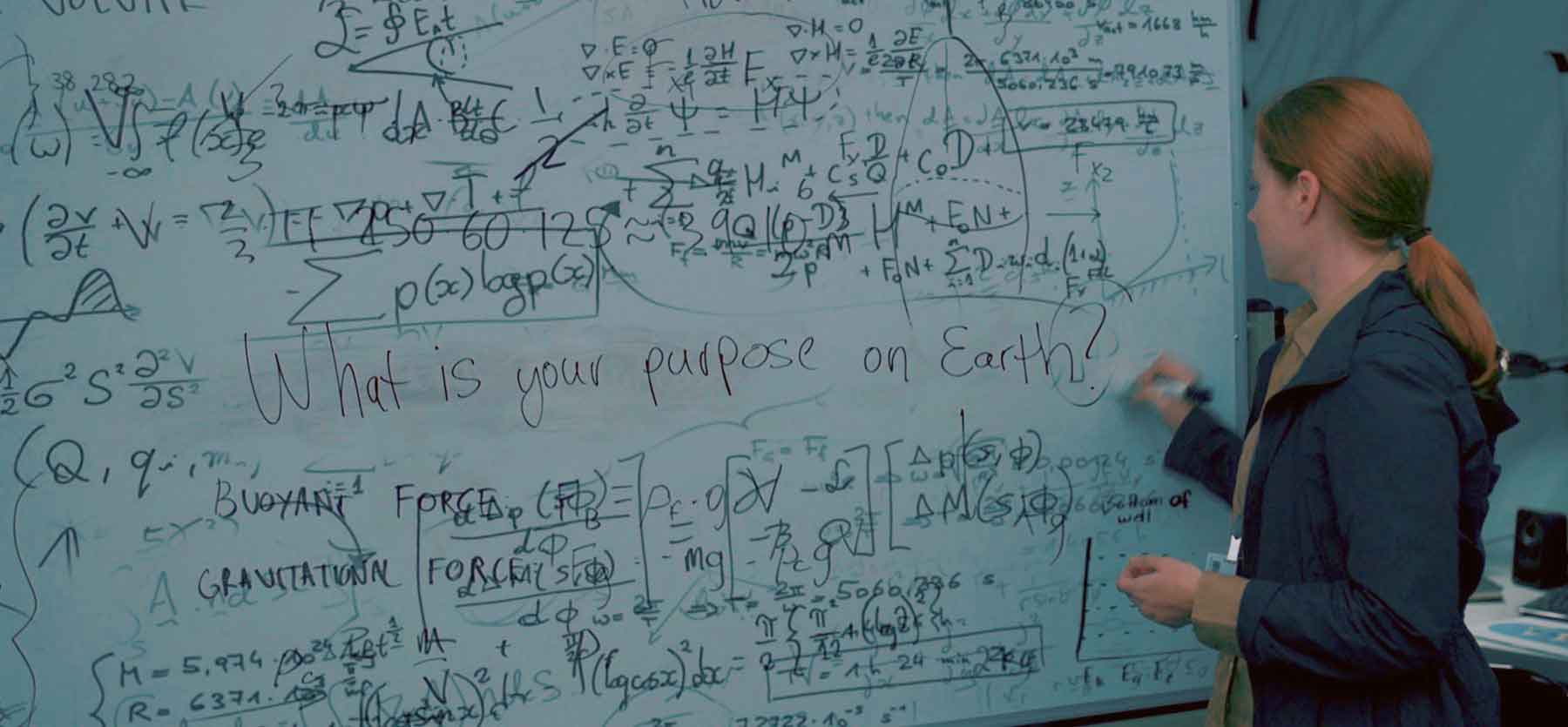 Louise at the whiteboard — you can't jump to "what is your purpose on Earth?" without building shared language first